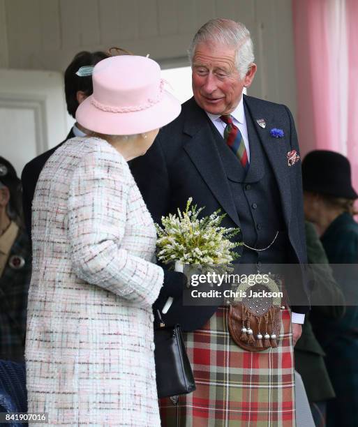 Queen Elizabeth II and Prince Charles, Prince of Wales watch the 2017 Braemar Gathering at The Princess Royal and Duke of Fife Memorial Park on...