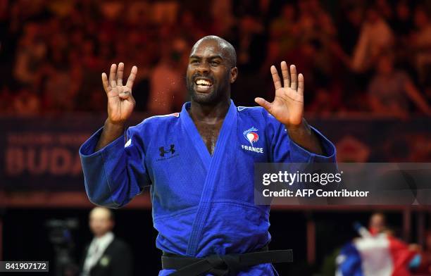 Gold medalist France's Teddy Riner celebrates on the tatami after his final in the mens +100kg category at the World Judo Championships in Budapest...