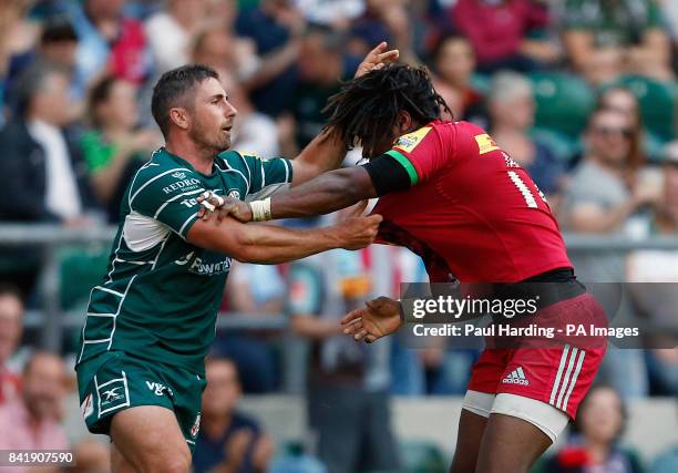 Harlequin's Marland Yarde clashes with London Irish's Brendan McKibbin after scoring his side's second try during the Aviva Premiership match at...