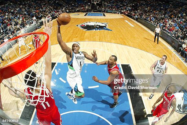 Rashad McCants of the Minnesota Timberwolves goes up for a shot against Yao Ming and Chuck Hayes of the Houston Rockets during the game at Target...