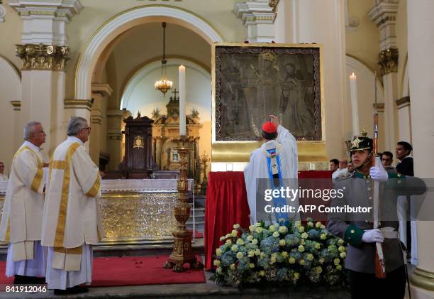 Cardinal Ruben Salazar Gomez blesses the image of Our Lady of Chiquinquira at Bogota's Primada Cathedral, where it was installed for Pope Francis'...