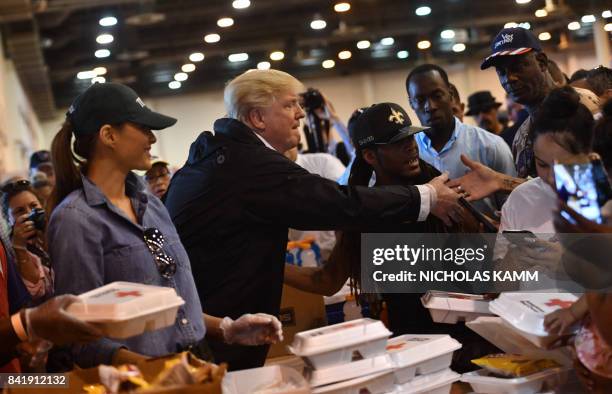 President Donald Trump and First Lady Melania Trump serve food to Hurricane Harvey victims at NRG Center in Houston on September 2, 2017.