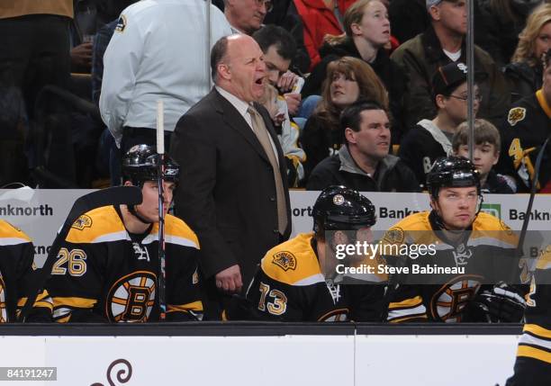 Head coach Claude Julien of the Boston Bruins reacts on the bench during a game against the Minnesota Wild at the TD Banknorth Garden on January 6,...