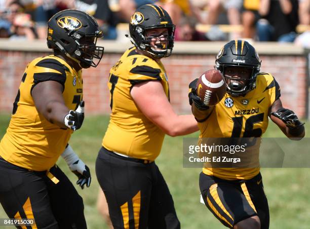 Damarea Crockett of the Missouri Tigers celebrates his touchdown with Tyler Howell and Paul Adams in the first quarter at Memorial Stadium on...