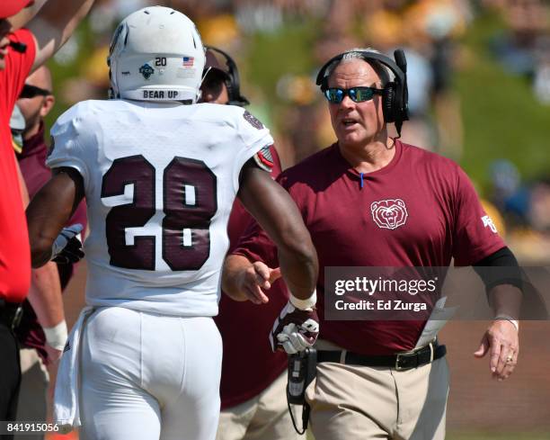 Missouri State Bears head coach Dave Steckel congratulates running back Calan Crowder after Crowder's touchdown run against the Missouri Tigers in...