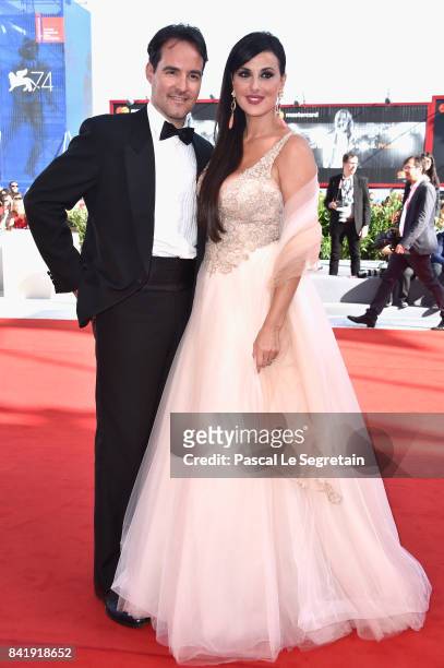 Vittorio Palazzi and Isabelle Adriani walk the red carpet ahead of the 'Foxtrot' screening during the 74th Venice Film Festival at Sala Grande on...
