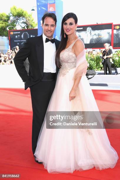 Vittorio Palazzi and Isabelle Adriani walk the red carpet ahead of the 'Foxtrot' screening during the 74th Venice Film Festival at Sala Grande on...