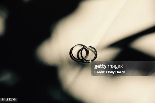 wedding rings, shadows - engagement ring stock-fotos und bilder