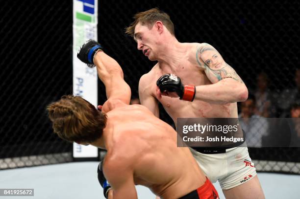 Bojan Velickovic of Serbia punches Darren Till of England in their welterweight bout during the UFC Fight Night event at the Rotterdam Ahoy on...