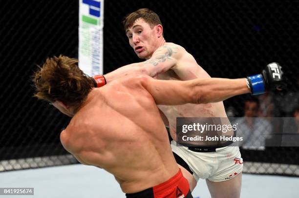 Darren Till of England punches Bojan Velickovic of Serbia in their welterweight bout during the UFC Fight Night event at the Rotterdam Ahoy on...