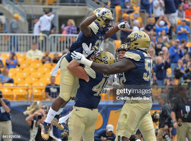 Davis of the Pittsburgh Panthers celebrates after rushing for a 1 yard touchdown in the second quarter during the game against the Youngstown State...