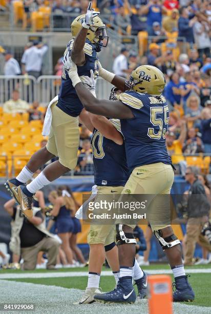 Davis of the Pittsburgh Panthers celebrates after rushing for a 1 yard touchdown in the second quarter during the game against the Youngstown State...