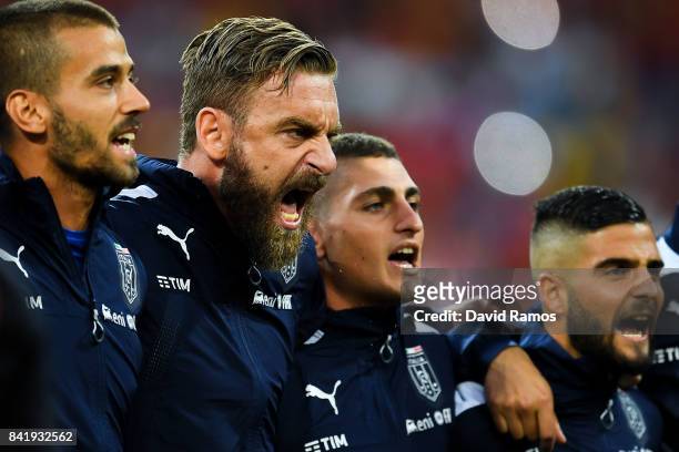 Daniele de Rossi and Marco Verratti of Italy sing the Italy's national anthem prior to the FIFA 2018 World Cup Qualifier between Spain and Italy at...