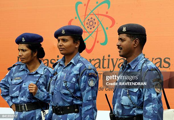 Indian Rapid Action Force soldiers stand guard in front of the