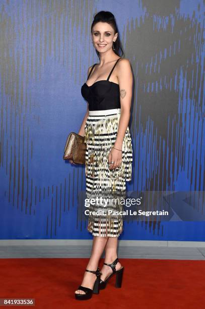 Federica Vincenti walks the red carpet ahead of the 'Suburra. La Serie' screening during the 74th Venice Film Festival at Sala Giardino on September...