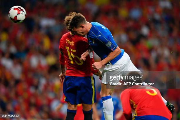 Spain's defender Sergio Ramos vies with Italy's forward Andrea Belotti during the World Cup 2018 qualifier football match Spain vs Italy at the...