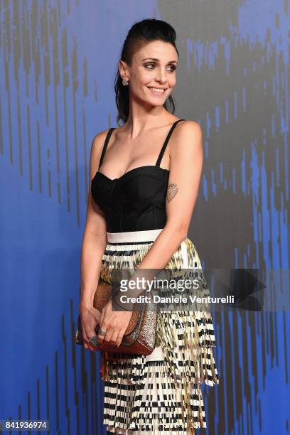 Federica Vincenti walks the red carpet ahead of the 'Suburra. La Serie' screening during the 74th Venice Film Festival at Sala Giardino on September...