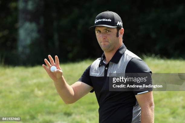 Jon Rahm of Spain acknowledges the crowd after putting on the ninth green during round two of the Dell Technologies Championship at TPC Boston on...