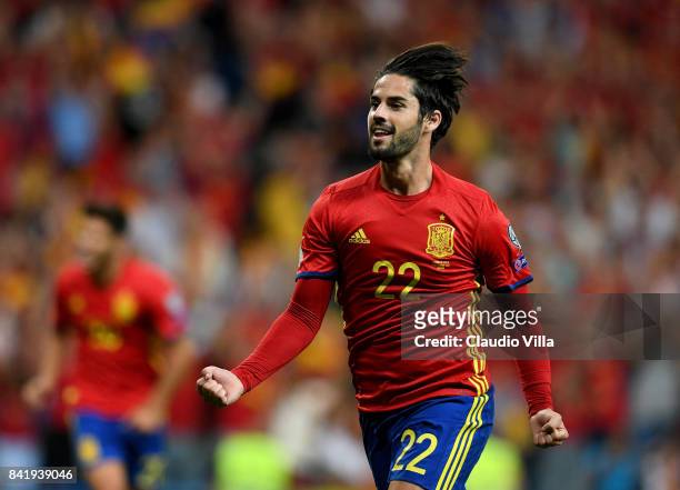 Spain's midfielder Isco celebrates after scoring the opening goal during the FIFA 2018 World Cup Qualifier between Spain and Italy at Estadio...