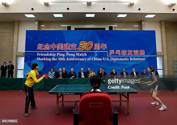 Deputy Secretary of State John Negroponte, center left, and China Vice Foreign Minister Wang Guangya, center right, watches a table tennis games play...