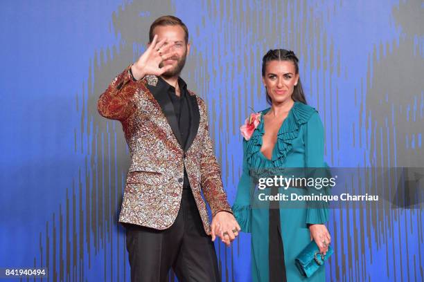 Alessandro Borghi and Roberta Pitrone walk the red carpet ahead of the 'Suburra. La Serie' screening during the 74th Venice Film Festival at Sala...