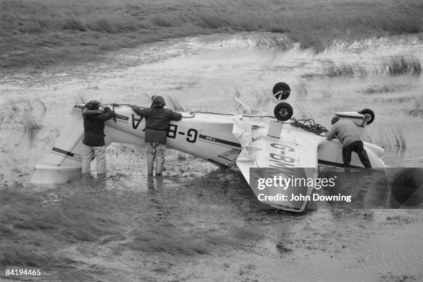 Pierre Robin light aircraft G-BMKA is found upside-down in a field after the Great Storm in southern England, 17th October 1987.