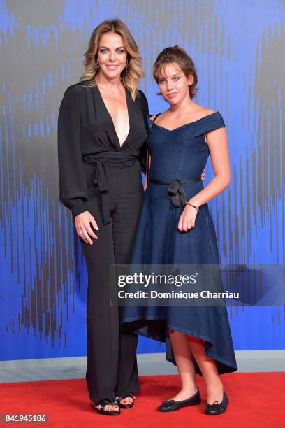 Claudia Gerini and Rosa Enginoli walk the red carpet ahead of the 'Suburra. La Serie' screening during the 74th Venice Film Festival at Sala Giardino...