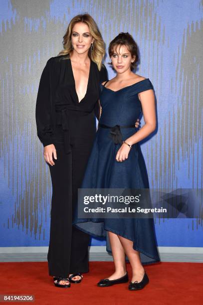 Claudia Gerini and Rosa Enginoli walk the red carpet ahead of the 'Suburra. La Serie' screening during the 74th Venice Film Festival at Sala Giardino...