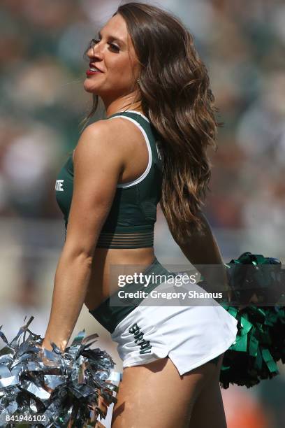 Member of the Michigan State Spartans dance team performs during a game against the Bowling Green Falcons at Spartan Stadium on September 2, 2017 in...