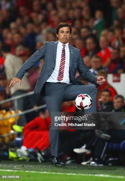 Chris Coleman manager of Wales controls the ball on the touchline during the FIFA 2018 World Cup Qualifier between Wales and Austria at Cardiff City...