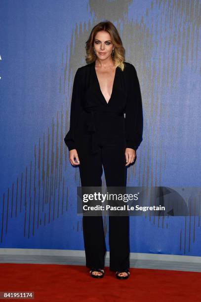 Claudia Gerini walks the red carpet ahead of the 'Suburra. La Serie' screening during the 74th Venice Film Festival at Sala Giardino on September 2,...