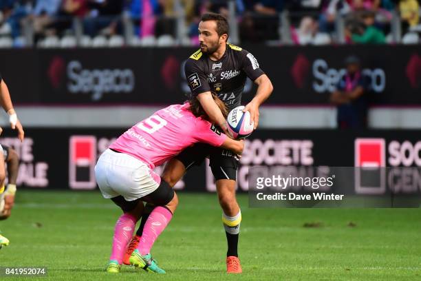Alexi Bales of La Rochelle and Charl McLeod of Stade Francais Paris during the Top 14 match between Stade Francais and La Rochelle on September 2,...