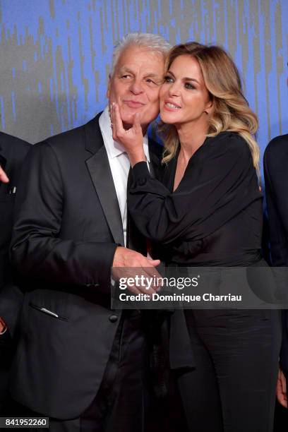 Michele Placido and Claudia Gerini walk the red carpet ahead of the 'Suburra. La Serie' screening during the 74th Venice Film Festival at Sala...