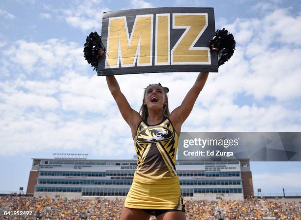 Missouri Tigers cheerleader pumps up the crowds during a game against the Missouri State Bears in the fourth quarter at Memorial Stadium on September...