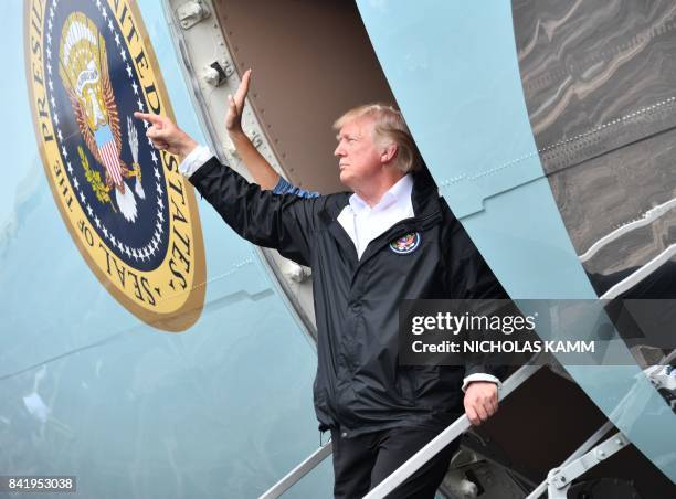 President Donald Trump boards Air Force One at Ellington Field on September 2 before departing for Louisiana to continue their tour of areas affected...