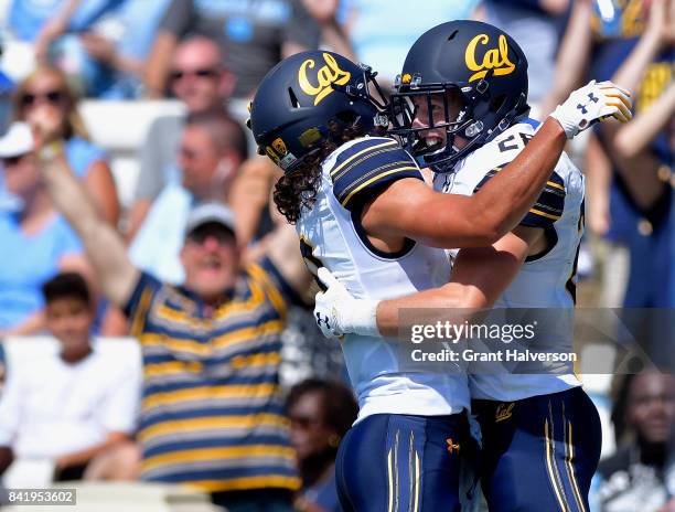 Patrick Laird celebrates with teamate Kanawai Noa of the California Golden Bears after scoring on a 54-yard pass against the North Carolina Tar Heels...