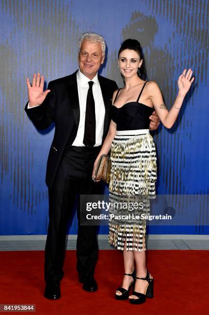 Michele Placido and Federica Vincenti walk the red carpet ahead of the 'Suburra. La Serie' screening during the 74th Venice Film Festival at Sala...