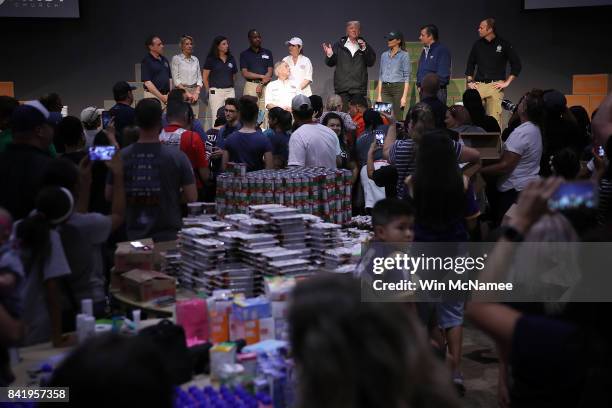 President Donald Trump speaks to volunteers packing emergency supplies for residents impacted by Hurricane Harvey at the First Church of Pearland...