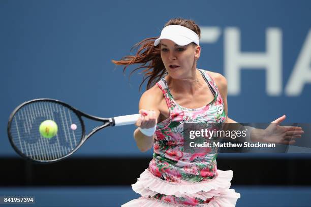 Agnieszka Radwanska of Poland returns a shot to CoCo Vandeweghe of the United States during their third round Women's Single's match on Day Six of...