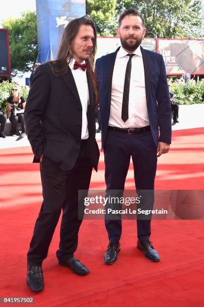 Gigi Piras and Luca de Franceschi walk the red carpet ahead of the 'Foxtrot' screening during the 74th Venice Film Festival at Sala Grande on...