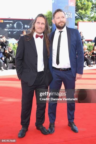 Gigi Piras and Luca de Franceschi walk the red carpet ahead of the 'Foxtrot' screening during the 74th Venice Film Festival at Sala Grande on...