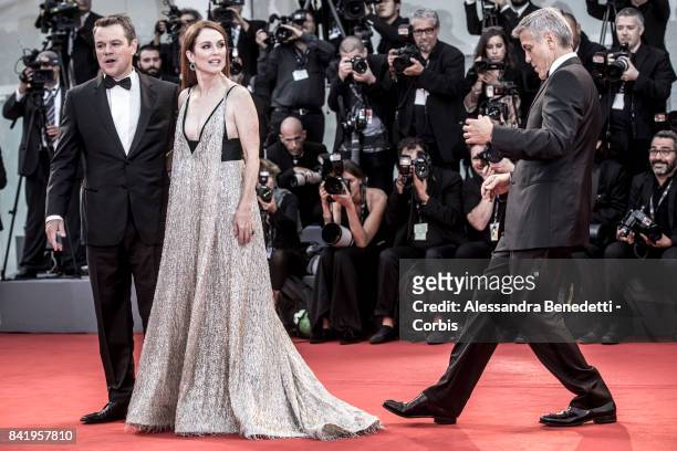 Matt Damon, Julianne Moore and George Clooney walk the red carpet ahead of the 'Suburbicon' screening during the 74th Venice Film Festival at Sala...