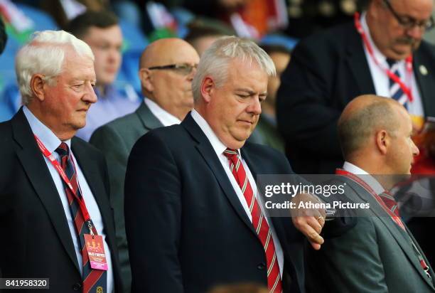 First Minister for Wales Carwyn Jones check the time during the FIFA World Cup Qualifier Group D match between Wales and Austria at The Cardiff City...