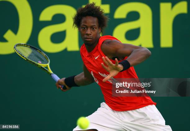Gael Monfils of France plays a forehand in his match against Nicolas Devilder of France during the Exxon Mobil Qatar Open Tennis on January 7, 2009...