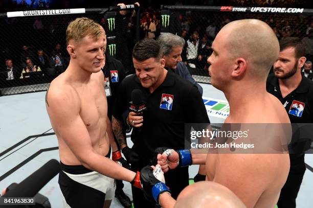 Alexander Volkov of Russia and Stefan Struve of The Netherlands touch gloves before their heavyweight bout during the UFC Fight Night event at the...