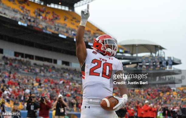 Christian Turner of the Youngstown State Penguins points to the sky after a 42 yard touchdown reception in the fourth quarter during the game against...