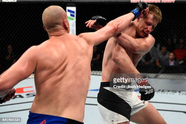 Stefan Struve of The Netherlands punches Alexander Volkov of Russia in their heavyweight bout during the UFC Fight Night event at the Rotterdam Ahoy...
