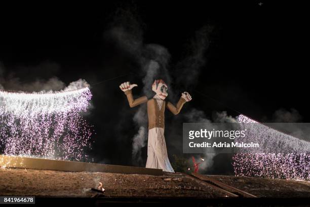 Fire dancer performs in front of "Old Man Gloom" before the burning of the effigy at the 93rd Annual Burning Of The Zozobra on September 1, 2017 in...