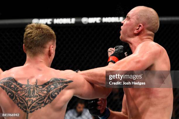 Alexander Volkov of Russia punches Stefan Struve of The Netherlands in their heavyweight bout during the UFC Fight Night event at the Rotterdam Ahoy...