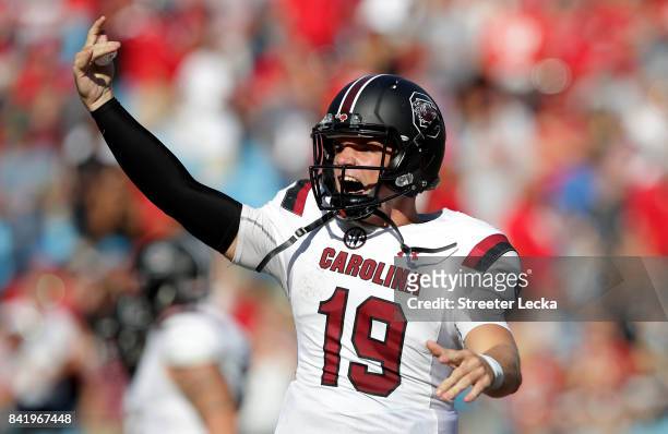Jake Bentley of the South Carolina Gamecocks reacts after throwing a touchdown against the North Carolina State Wolfpack during their game at Bank of...